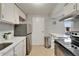 Kitchen featuring stainless steel appliances and white cabinets at 4215 E Bay Dr # 1801E, Clearwater, FL 33764