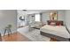 Stylish living room with modern decor including a comfortable sofa, bed, and natural lighting at 4215 E Bay Dr # 1801E, Clearwater, FL 33764
