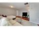 Inviting living room with hardwood floors, comfortable seating, and television offering a cozy space at 4215 E Bay Dr # 1801E, Clearwater, FL 33764