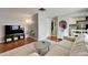 Inviting living room with hardwood floors, neutral paint, and cozy furnishings at 4215 E Bay Dr # 1801E, Clearwater, FL 33764