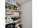 Walk-in pantry featuring custom shelving with a variety of food and kitchen supplies at 4215 E Bay Dr # 1801E, Clearwater, FL 33764