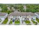 New townhomes showcase modern architecture, manicured lawns, and private driveways in a vibrant community at 4338 Banjo Lake Rd, Land O Lakes, FL 34639