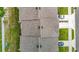 An aerial view of townhome roofs, driveways, and lawns at 4338 Banjo Lake Rd, Land O Lakes, FL 34639