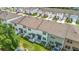 An aerial view of townhomes with well-maintained lawns at 4338 Banjo Lake Rd, Land O Lakes, FL 34639