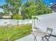A tranquil fenced backyard with a patio and table at 4338 Banjo Lake Rd, Land O Lakes, FL 34639