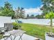 A beautiful view of the backyard with a table and chairs at 4338 Banjo Lake Rd, Land O Lakes, FL 34639