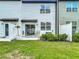 A view of the backyard with a patio, table, chairs, and privacy fence at 4338 Banjo Lake Rd, Land O Lakes, FL 34639