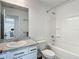 Well-maintained bathroom with a vanity, sink, granite countertop, and a tub with a shower at 4338 Banjo Lake Rd, Land O Lakes, FL 34639