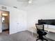 Well-lit bedroom with a ceiling fan, a workspace and easy access to the ensuite bathroom at 4338 Banjo Lake Rd, Land O Lakes, FL 34639