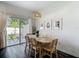 Dining room area features a sliding door to the patio and modern decor at 4338 Banjo Lake Rd, Land O Lakes, FL 34639