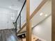 Modern entryway with open staircase, stylish railings, and tiled floors at 4338 Banjo Lake Rd, Land O Lakes, FL 34639