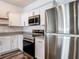 Well-equipped kitchen boasts modern appliances, granite countertops, and sleek cabinetry at 4338 Banjo Lake Rd, Land O Lakes, FL 34639