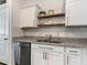 Kitchen features stainless steel appliances, white cabinets and granite countertops at 4338 Banjo Lake Rd, Land O Lakes, FL 34639