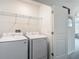 Convenient laundry room equipped with a modern washer and dryer, ensuring efficient laundry care at 4338 Banjo Lake Rd, Land O Lakes, FL 34639