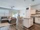 Open-concept living area with stylish furnishings, dining area, and seamless kitchen access at 4338 Banjo Lake Rd, Land O Lakes, FL 34639