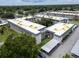 An aerial view of a multi-building apartment complex with covered parking and landscaped grounds at 5720 13Th N Ave # 207B, St Petersburg, FL 33710