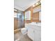 A bathroom featuring a white vanity and a shower with glass doors at 5720 13Th N Ave # 207B, St Petersburg, FL 33710