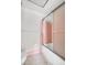 A retro bathroom featuring pink tiling, mosaic floors, and a classic tub/shower combo at 5720 13Th N Ave # 207B, St Petersburg, FL 33710