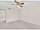 A simplistic bedroom with a ceiling fan at 5720 13Th N Ave # 207B, St Petersburg, FL 33710