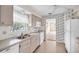 Kitchen featuring white appliances, double sink and natural light at 5720 13Th N Ave # 207B, St Petersburg, FL 33710