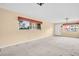 Living room with carpet, natural light, and white trim at 5720 13Th N Ave # 207B, St Petersburg, FL 33710