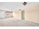 Spacious living room featuring carpet floors, and chandelier lighting at 5720 13Th N Ave # 207B, St Petersburg, FL 33710