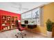 A well-lit office space with large windows, a modern desk, and a built-in bookshelf at 5720 13Th N Ave # 207B, St Petersburg, FL 33710