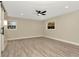 Bedroom with wood floors, recessed lighting, and a modern barn door closet at 5749 Southernview Dr, Zephyrhills, FL 33541