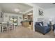 Open living space with a view of the kitchen, dining area, and an inviting patio at 630 Kirkland Cir, Dunedin, FL 34698