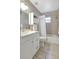 Neutral-toned bathroom with shower-tub combo and bright vanity at 6603 S Juanita St, Tampa, FL 33616