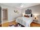 Light bedroom with hard floors, modern fan and black decorative headboard at 6603 S Juanita St, Tampa, FL 33616