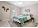 Serene bedroom with a plush bed, soft lighting, and calming wall decor at 6603 S Juanita St, Tampa, FL 33616