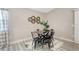 Contemporary dining area featuring a black table, metal chairs, and decorative wall elements at 6603 S Juanita St, Tampa, FL 33616
