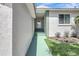 Inviting entrance featuring a green pathway and trimmed landscaping leads to the front door at 6603 S Juanita St, Tampa, FL 33616