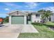 Charming single-story home with a well-manicured lawn, and a one car garage at 6603 S Juanita St, Tampa, FL 33616