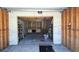 Spacious garage featuring a custom-built loft area with wood stairs, providing additional storage and functionality at 6603 S Juanita St, Tampa, FL 33616