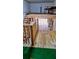 Interior view of a garage featuring custom wooden shelving, adding practical storage and a workshop area at 6603 S Juanita St, Tampa, FL 33616