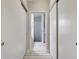 Hallway featuring closet and bathroom entrance at 6603 S Juanita St, Tampa, FL 33616