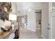 Bright open-concept layout with wood-look flooring and modern furnishings for comfortable living at 6603 S Juanita St, Tampa, FL 33616