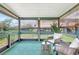 Enclosed lanai with comfortable seating and outside view at 6603 S Juanita St, Tampa, FL 33616