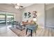 Comfortable living room with a sliding glass door to the screened in porch and stylish decor at 6603 S Juanita St, Tampa, FL 33616