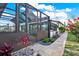 Enjoy an evening in the screened-in lanai, accessible from the backyard and surrounded by lovely foliage at 7305 Jasmine Blvd, Port Richey, FL 34668