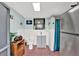 This functional bathroom offers a toilet, sink, shower, and stainless steel fridge for added convenience at 7305 Jasmine Blvd, Port Richey, FL 34668