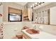 Bathroom featuring a peach toilet and sink, complemented by floral wallpaper at 7305 Jasmine Blvd, Port Richey, FL 34668