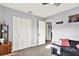 Bedroom featuring a closet with louvered doors, and grey walls at 7305 Jasmine Blvd, Port Richey, FL 34668