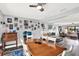 Open concept living room flows from the dining area and features an eclectic wall decor at 7305 Jasmine Blvd, Port Richey, FL 34668