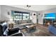 Cozy living room featuring modern decor, a large window, and stylish furnishings at 7305 Jasmine Blvd, Port Richey, FL 34668