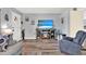Living room showcasing an electric fireplace and a comfortable seating arrangement at 7305 Jasmine Blvd, Port Richey, FL 34668
