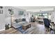 Open-concept living room with modern furniture and decor at 7305 Jasmine Blvd, Port Richey, FL 34668