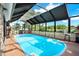 Enjoy swimming year-round with this large, inviting screened-in pool, perfect for relaxation and recreation at 7305 Jasmine Blvd, Port Richey, FL 34668